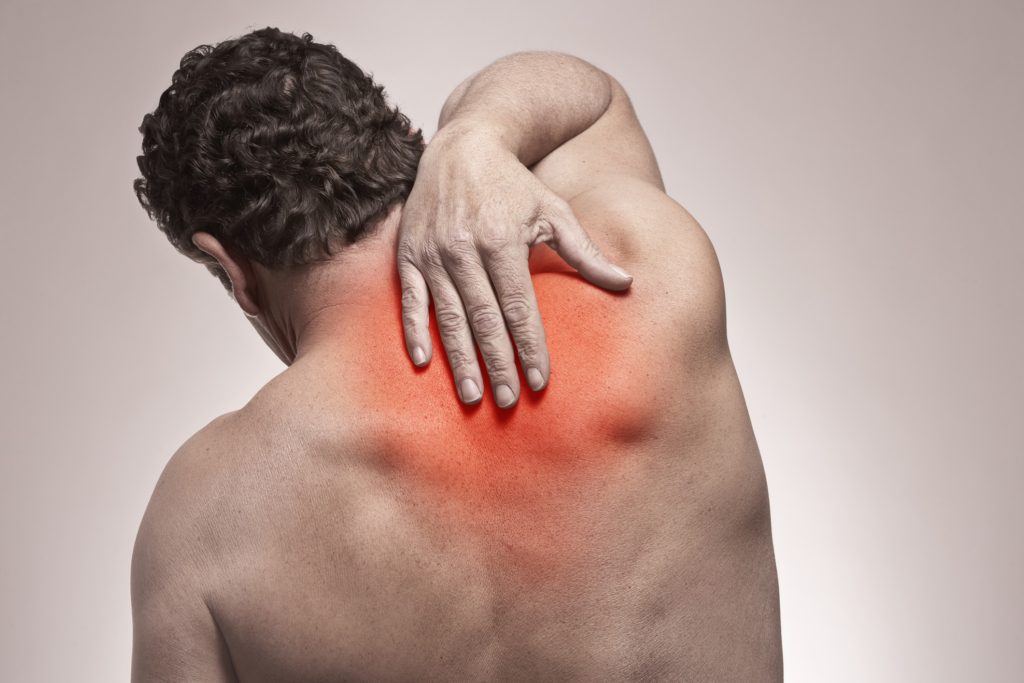 Man with neck pain needing osteopathic treatment available at Triple H Osteocare on the Central Coast.